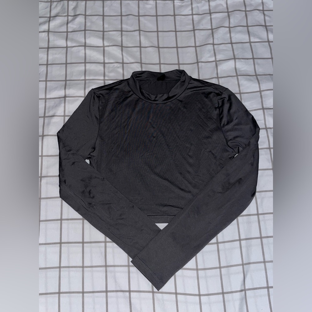 Dark grey shein long sleeve. High neck line.